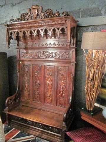 ANTIQUE 19TH CENTURY WALNUT HALL BENCH WITH INTRIC: ANTIQUE 19TH CENTURY WALNUT HALL BENCH WITH INTRICATELY CARVED DETAIL, STORAGE UNDER HINGED SEAT, EXCELLENT CONDITION WITH NO APPARENT CHIPS OR MISSING ELEMENTS, APPROX 6'L X 8' H