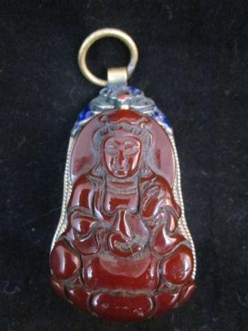 CARVED CARNELIAN BUDDHA PENDANT WITH ENAMEL/CLOISO: CARVED CARNELIAN BUDDHA PENDANT WITH ENAMEL/CLOISONNE DETAIL, APPROX 3" OVERALL