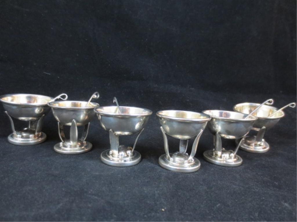 CARL POUL PETERSEN SIX INDIVIDUAL STERLING SILVER : CARL POUL PETERSEN SIX INDIVIDUAL STERLING SILVER SALTS W/5 SPOONS, APPROX 1.25" DIAMETER, APPROX 122 GRAMS, MARKED PP STERLING. MASTER CANADIAN SILVERSMITH PETERSEN TRAINED WITH GEORG JENSEN AND MARR