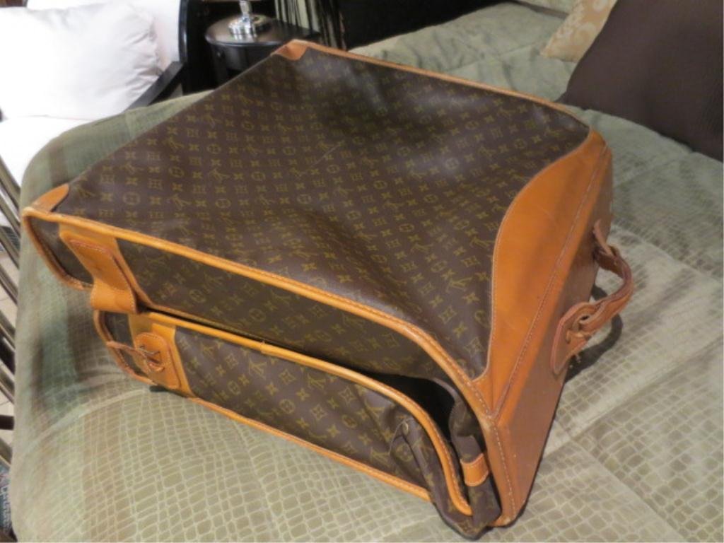 LOUIS VUITTON GARMENT BAG, MANUFACTURED BY THE FREN: LOUIS VUITTON GARMENT BAG, MANUFACTURED BY THE FRENCH CO., USA UNDER SPECIAL LICENSE, GOOD CONDITION, NO KEYS (ONE LOCK IS LOCKED), SOME TAPE DAMAGE, SCUFFING