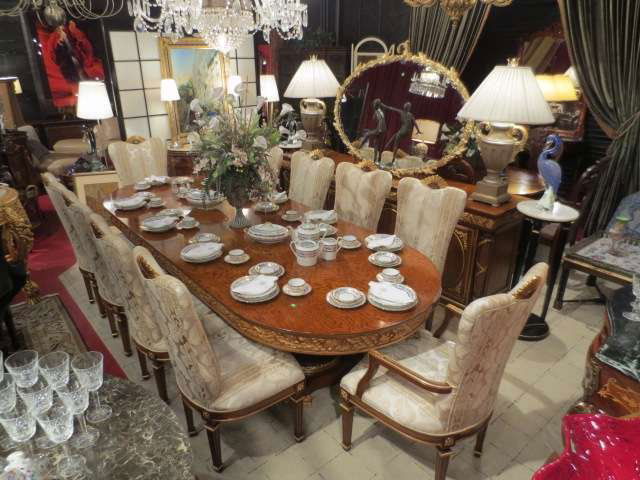 SPECTACULAR MADE IN ITALY EMPIRE STYLE DINING TABL: SPECTACULAR MADE IN ITALY EMPIRE STYLE DINING TABLE AND 10 CHAIRS, DUAL PEDESTAL TABLE WITH GOLD ACCENTS, CHAIRS ARE UPHOLSTERED IN CREAM TONE ON TONE UPHOLSTERY, LABELED JUMBO COLLECTION, ITALY, 122"