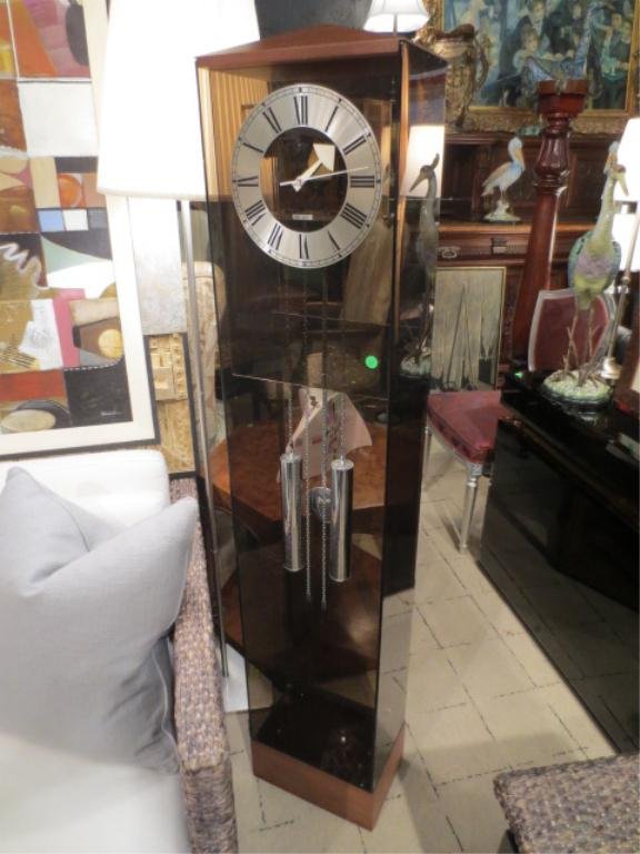 HOWARD MILLER BLACK LUCITE GRANDMOTHER CLOCK WITH S: HOWARD MILLER BLACK LUCITE GRANDMOTHER CLOCK WITH SILVER FINISH FACE AND PENDULUMS, MEDIUM WOOD TRIM, EXCELLENT CONDITION, APPROX 5' H