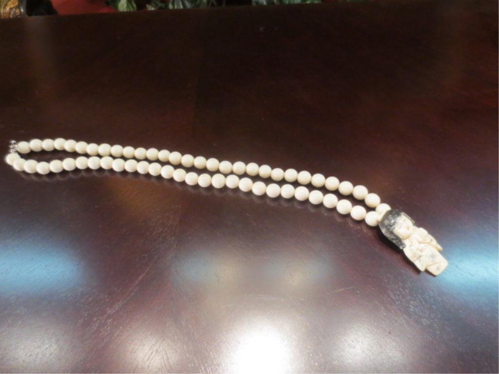 CARVED IVORY NECKLACE - IVORY BEADS WITH NETSUKE G: CARVED IVORY NECKLACE - IVORY BEADS WITH NETSUKE GIRL, APPROX 24" LONG OVERALL