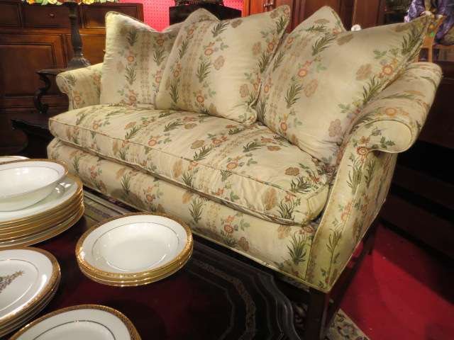 VINTAGE ENGLISH CAMELBACK LOVESEAT, LIGHT CREAM UP: VINTAGE ENGLISH CAMELBACK LOVESEAT, LIGHT CREAM UPHOLSTERY, CLASSIC RIBBON PRINT WITH EMBROIDERED FLOWERS, MEDIUM FINISH LEGS, DOWN FILLED SEAT AND 3 BACK CUSHIONS, EXCELLENT CONDITION, APPROX 5.5'L