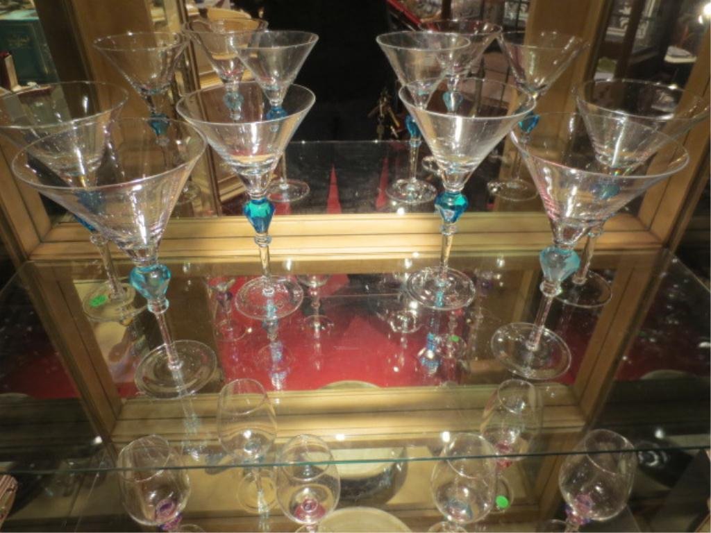 6 HUGE MARTINI GLASSES WITH BLUE FACETED GEMS IN THE ST: 6 HUGE MARTINI GLASSES WITH BLUE FACETED GEMS IN THE STEMS, APPROX 9.25"H "** PLEASE NOTE: ARRANGEMENTS FOR SHIPPING AND PACKAGING ARE THE SOLE RESPONSIBILITY OF THE WINNING BIDDER. THE AUCTION HOUSE 
