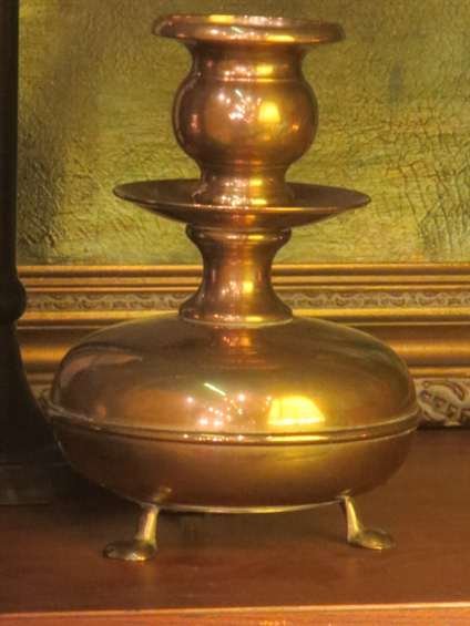 SMALL BRASS CANDLE HOLDER, APPROX 7"H: SMALL BRASS CANDLE HOLDER, APPROX 7"H ~~~ PLEASE NOTE: ARRANGEMENTS FOR SHIPPING AND PACKAGING ARE THE SOLE RESPONSIBILITY OF THE WINNING BIDDER. THE AUCTION HOUSE DOES NOT PROVIDE PACKING/CRATING SER