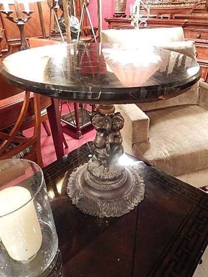 METAL FIGURAL TABLE, 2 CHERUBS, BLACK MARBLE TOP,: METAL FIGURAL TABLE, 2 CHERUBS, BLACK MARBLE TOP, APPROX 16" DIAMETER