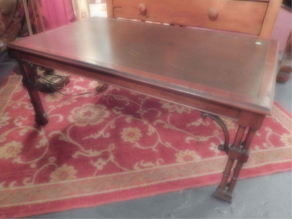 CARVED WOOD FAUX BAMBOO STYLE COFFEE TABLE, LEATHER: CARVED WOOD FAUX BAMBOO STYLE COFFEE TABLE, LEATHER TOP, ONE HOLE IN LEATHER APPROX 1" LONG, TABLE IS APPROX 3.5' X 2'