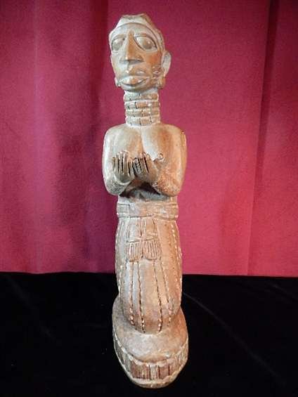 AFRICAN CARVED WOODEN FERTILITY FIGURE, WOMAN KNEELING: AFRICAN CARVED WOODEN FERTILITY FIGURE, WOMAN KNEELING & HOLDING OUT HER HANDS, BABY ON HER BACK, PAINTED WHITE AND BLUE, FROM YORUBA TRIBE, NIGERIA, WEST AFRICA, APPROX 16"H