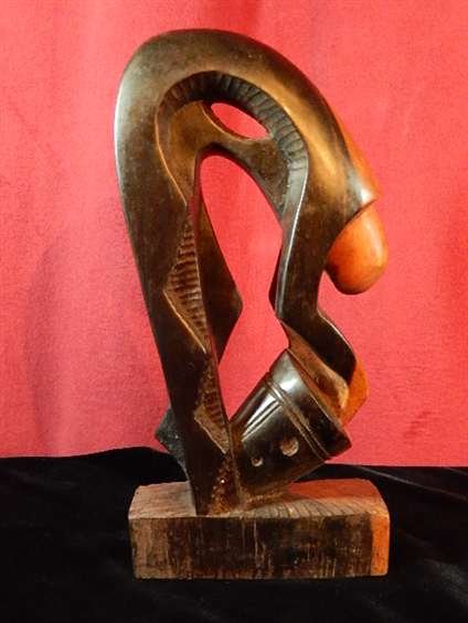 AFRICAN CARVED WOODEN SCULPTURE, DRUMMER, MADE OF: AFRICAN CARVED WOODEN SCULPTURE, DRUMMER, MADE OF EBONY, APPROX 12" X 5.75"