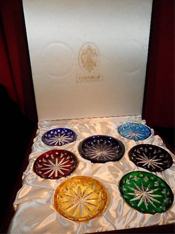 FABERGE COLORED CRYSTAL COASTER WINE SET INCLUDES: FABERGE COLORED CRYSTAL COASTER WINE SET INCLUDES COASTER FOR WINE BOTTLE & 6 COASTERS FOR WINE GLASSES, IN ORIGINAL PRESENTATION BOX. EACH COASTER ETCHED "FABERGE".