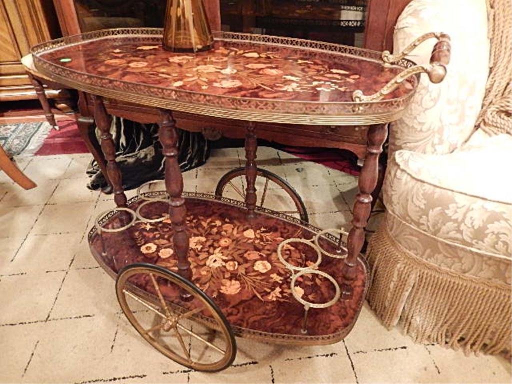 ITALIAN MARQUETRY INLAID SERVICE CART, OVAL WITH BRASS: ITALIAN MARQUETRY INLAID SERVICE CART, OVAL WITH BRASS RAILS, LOWER TIER HAS TWO BRASS GALLERIES, APPROX 27"H X 31" W X 19"D