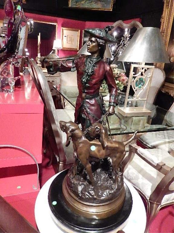 AFTER H.F. MOREAU & P. LECOURTIER BRONZE SCULPTURE,: AFTER H.F. MOREAU & P. LECOURTIER BRONZE SCULPTURE, "HUNTER WITH HOUNDS", DEPICTS A FRENCH HUNTSMAN OF THE LOUIS XV PERIOD ACCOMPANIED BY HIS TWO HOUNDS, PATINATED FINISH, SIGNED F. DELUCA, APPROX 32"