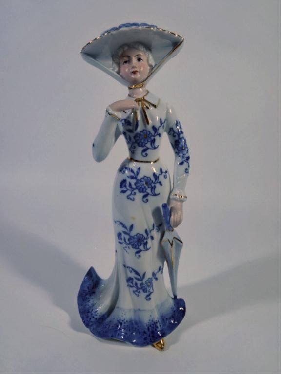 KPM GERMAN PORCELAIN FIGURE, LADY WITH PARASOL, BLUE: KPM GERMAN PORCELAIN FIGURE, LADY WITH PARASOL, BLUE AND WHITE WITH GOLD ACCENTS, WITH KPM CROWN MARK, 9"H X 4"W (SKU# 934-12)