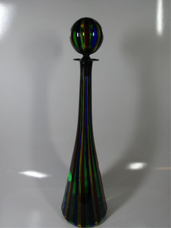 SEGUSO AV FOR OGGETTI ITALY MURANO LATTICINO GLASS: SEGUSO AV FOR OGGETTI ITALY MURANO LATTICINO GLASS GENIE BOTTLE DECANTER, RED, YELLOW, BLUE & GREEN STRIPES, WITH ROUND STOPPER, LABELED OGGETTI ITALY, CIRCA 1980s, APPROX 15"H SKU941.01