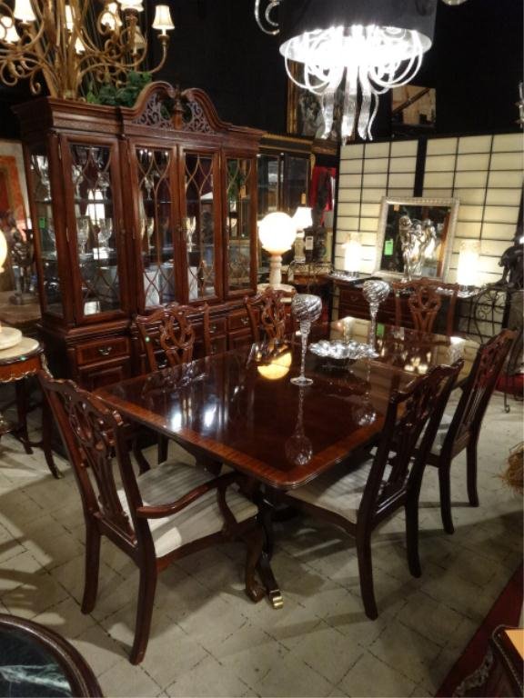 CHIPPENDALE MAHOGANY DINING TABLE BY UNIVERSAL: CHIPPENDALE MAHOGANY DINING TABLE BY UNIVERSAL FURNITURE, WITH 2 LEAVES, BANDED TOP, BRASS CAPPED FEET, INCLUDES 6 CHAIRS (2 ARMCHAIRS, 4 SIDE CHAIRS) WITH BALL AND CLAW FEET. MATCHING BREAKFRONT AND