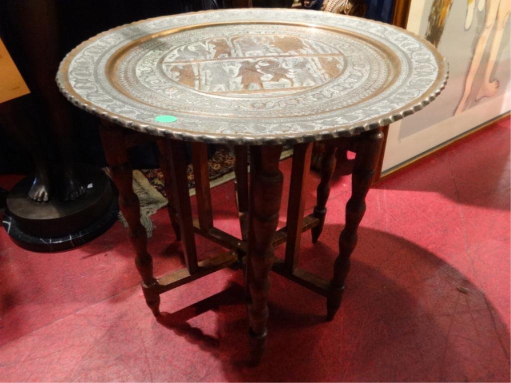 COPPER AND BRASS TABLE, FOLDING WOODEN BASE, EMBOSSED: COPPER AND BRASS TABLE, FOLDING WOODEN BASE, EMBOSSED FIGURAL DESIGNS, APPROX 15" DIAMETER, 15"H
