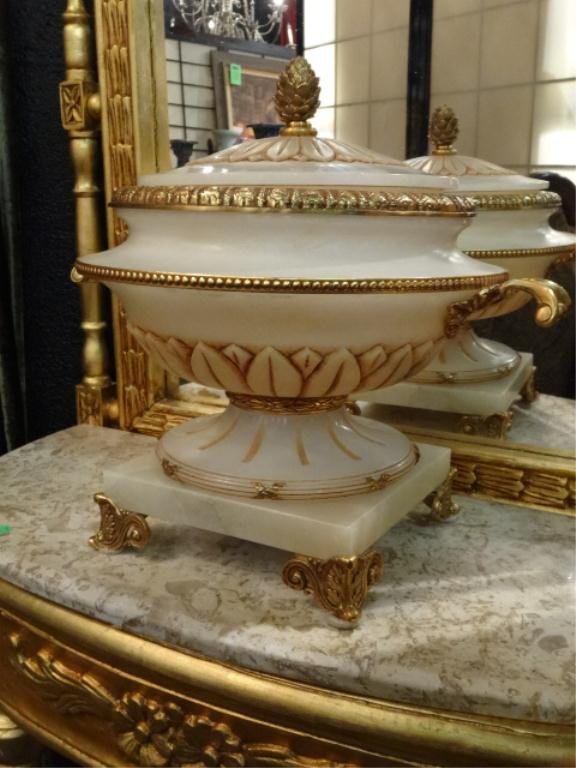ALABASTER URN WITH GILT BRONZE HANDLES, FEET, AND: ALABASTER URN WITH GILT BRONZE HANDLES, FEET, AND ACCENTS, CARVED WHITE ALABASTER BASE AND LID, MARKED "M" ON INTERIOR MEDALLION, APPROX 18" DIAMETER, 15"H, SKU149