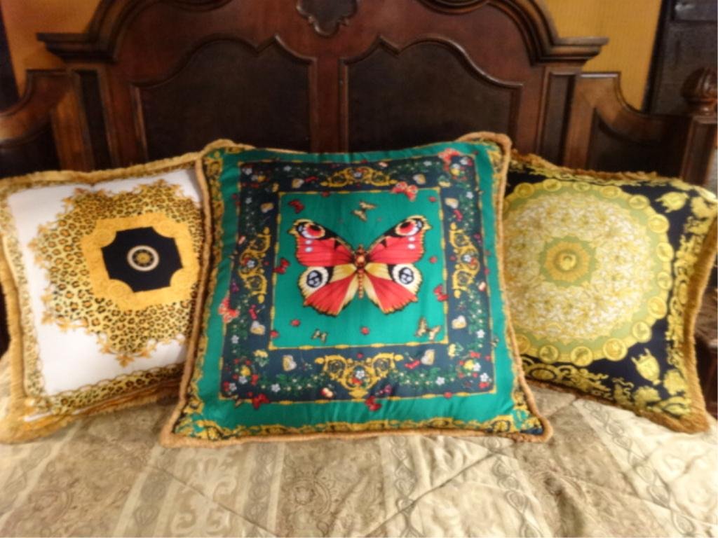 3 PC DESIGNER PILLOW SET, ONE ATELIER VERSACE LABELED: 3 PC DESIGNER PILLOW SET, ONE ATELIER VERSACE LABELED PILLOW WITH BUTTERFLIES, 2 VERSACE STYLE PILLOWS WITH MEDALLIONS, APPROX 25" X 25"