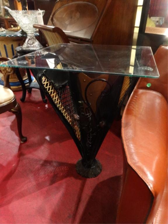 ARTIST DANIEL ROTH METAL TABLE, METAL FLORAL ACCENTS IN: ARTIST DANIEL ROTH METAL TABLE, METAL FLORAL ACCENTS IN TRIANGULAR BASE, WITH GLASS TOP, APPROX 26"H