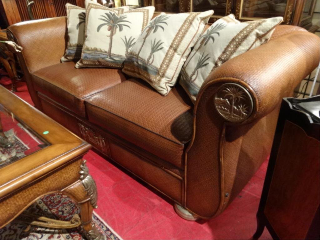 THOMASVILLE LEATHER AND RATTAN SOFA, LEATHER UPHOLSTERY: THOMASVILLE LEATHER AND RATTAN SOFA, LEATHER UPHOLSTERY ON RATTAN WRAPPED FRAME, BAMBOO ACCENTS, WITH BRONZE PALM MOTIF MEDALLIONS ON ROLL ARMS, PALM PRINT ACCENT PILLOWS, #2 OF TWO AVAILABLE (SOLD SE