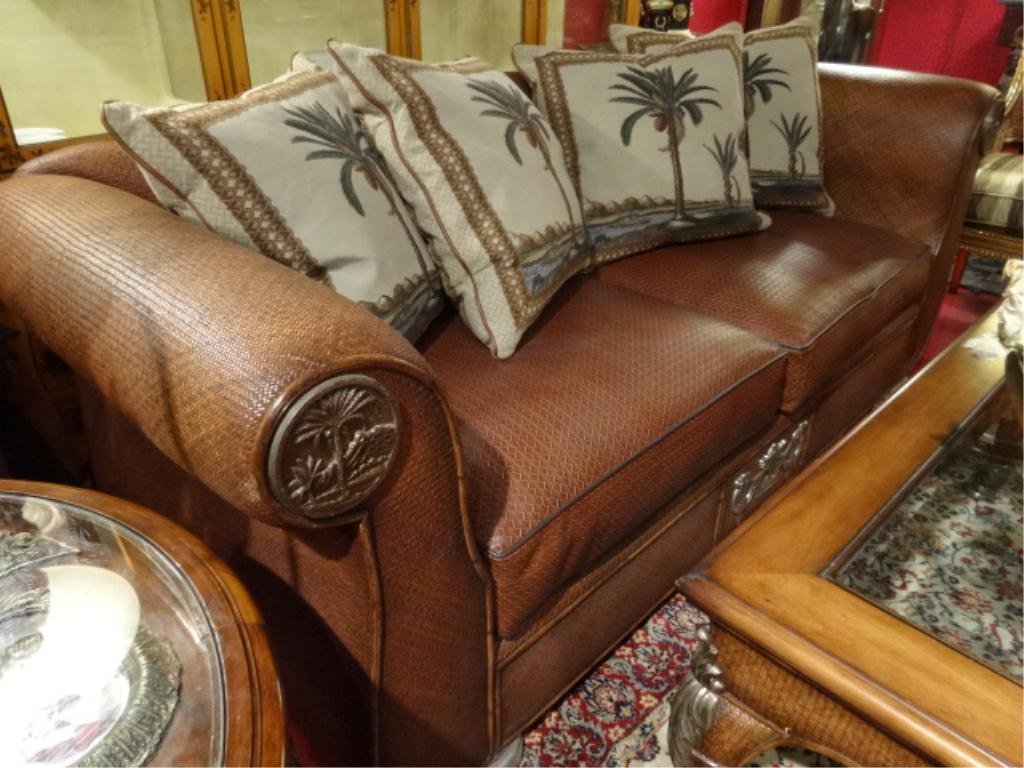 THOMASVILLE LEATHER AND RATTAN SOFA, LEATHER UPHOLSTERY: THOMASVILLE LEATHER AND RATTAN SOFA, LEATHER UPHOLSTERY ON RATTAN WRAPPED FRAME, BAMBOO ACCENTS, WITH BRONZE PALM MOTIF MEDALLIONS ON ROLL ARMS, PALM PRINT ACCENT PILLOWS, #1 OF TWO AVAILABLE (SOLD SE