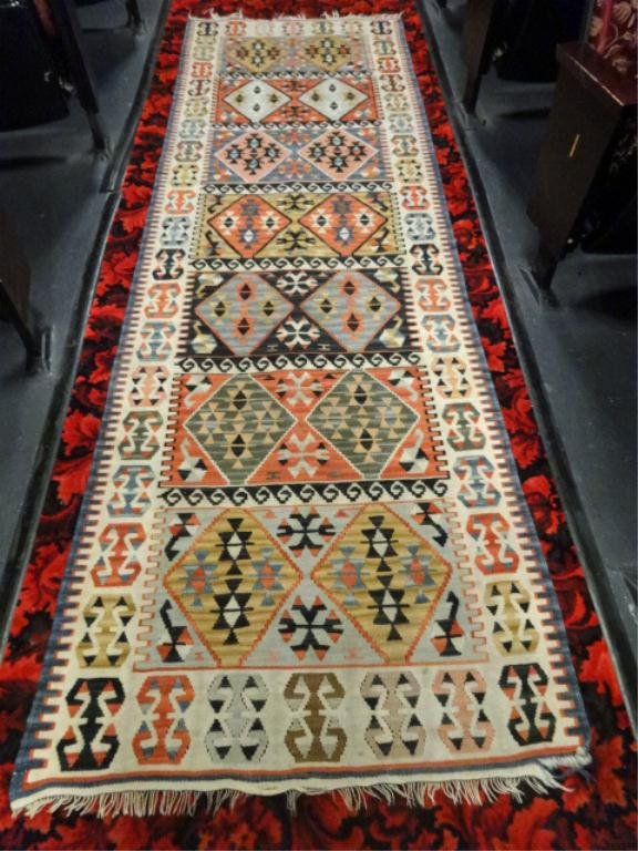 ANTIQUE WOOL RUG/RUNNER, KONYA KELIM, OR KILIM TURKISH: ANTIQUE WOOL RUG/RUNNER, KONYA KELIM, OR KILIM TURKISH CENTRAL ANATOLIA, WOOL ON WOOL FOUNDATION, POLYCHROME FIELD WITH 7 PANELS EACH ENCLOSING PAIRS OF DIAMOND MEDALLIONS WITH GULS, WITHIN AN IVORY H