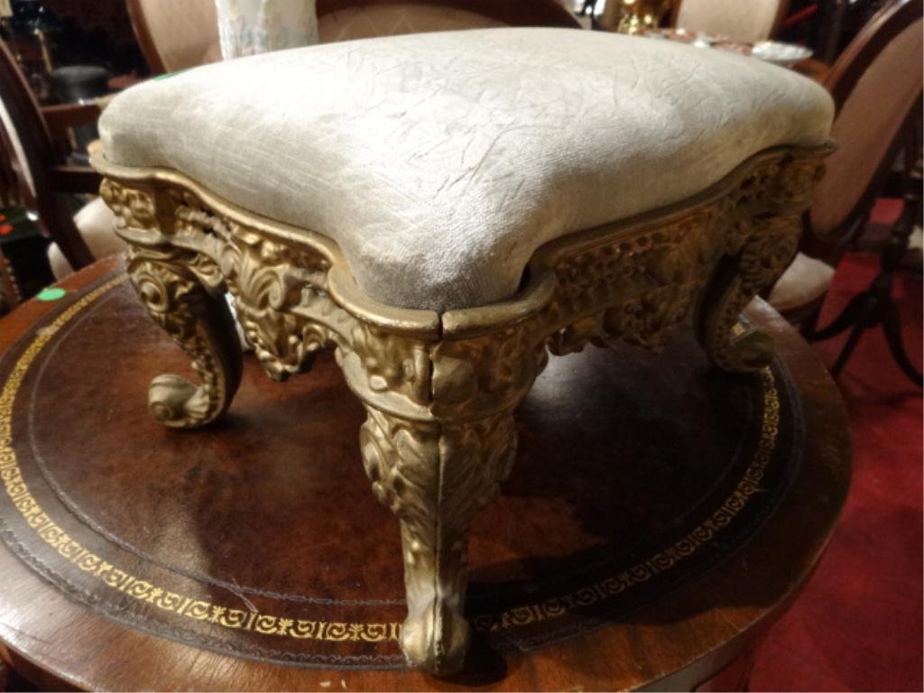 ANTIQUE METAL FOOTSTOOL, GOLD FINISH, REUPHOLSTERED: ANTIQUE METAL FOOTSTOOL, GOLD FINISH, REUPHOLSTERED CUSHION, APPROX 14"W, SKU325.08