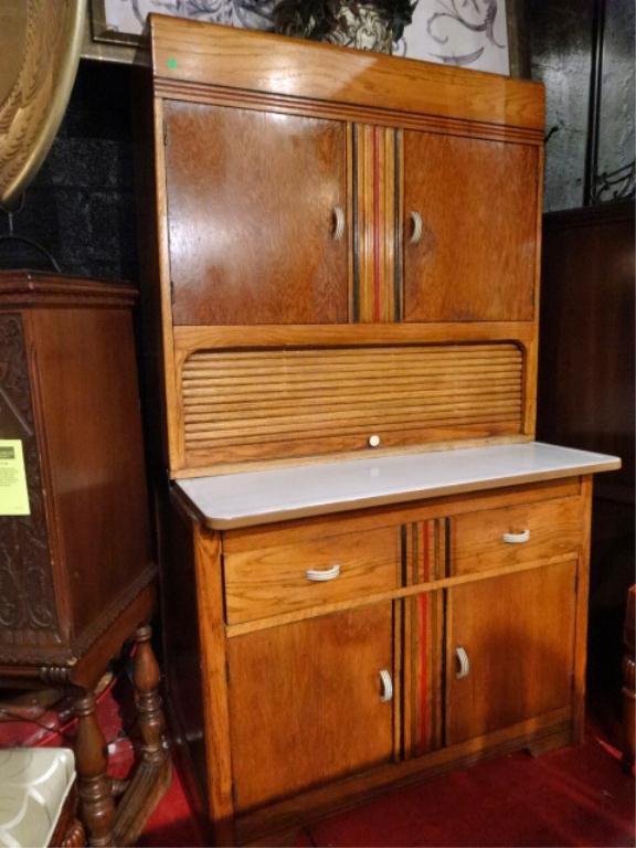HOOSIER TYPE CABINET CIRCA 1930's, BAKELITE HANDLES,: HOOSIER TYPE CABINET CIRCA 1930's, BAKELITE HANDLES, ENAMELED METAL TOP, TAMBOUR DOOR, MULTI COLOR STAIN STRIPED ACCENTS, 2 DOOR UPPER CABINET, 2 DRAWERS, 2 DOOR LOWER CABINET, EXCELLENT VINTAGE CONDI