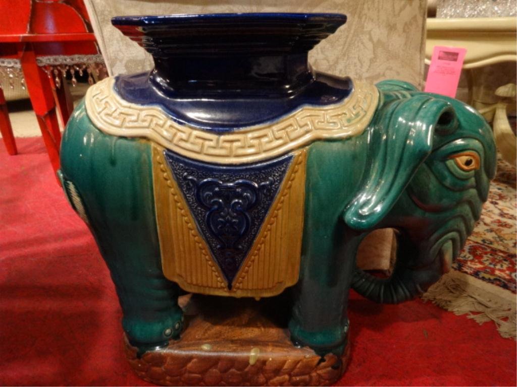 PORCELAIN ELEPHANT GARDEN STOOL, GREEN WITH YELLOW AND: PORCELAIN ELEPHANT GARDEN STOOL, GREEN WITH YELLOW AND PURPLE SADDLE, APPROX 25"W, #1 OF TWO AVAILABLE, EACH SOLD SEPARATELY