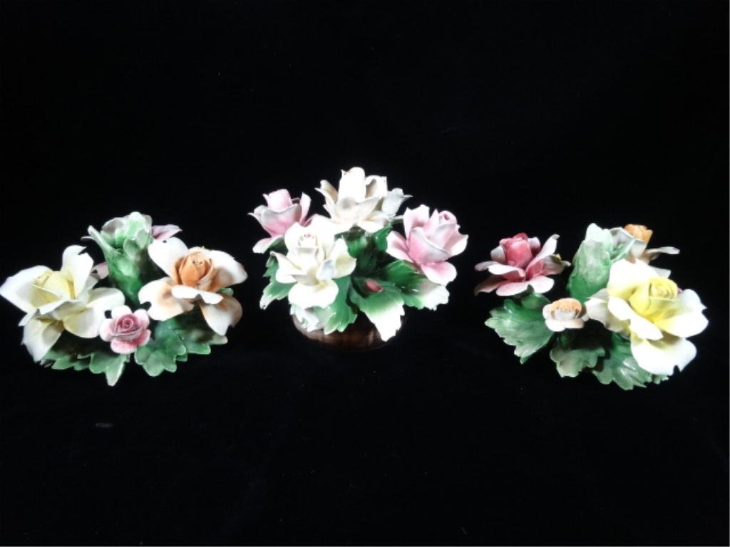 3 PC CAPODIMONTE PORCELAIN FLORAL ARRANGEMENTS, 2 ARE: 3 PC CAPODIMONTE PORCELAIN FLORAL ARRANGEMENTS, 2 ARE CANDLEHOLDERS & 1 CENTERPIECE, EACH APPROX 5" X 7", MADE IN ITALY, SKU485.01
