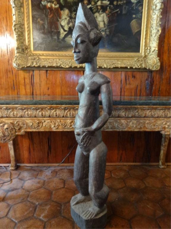 LARGE AFRICAN SCULPTURE, FEMALE FERTILITY FIGURE, ASSIE: LARGE AFRICAN SCULPTURE, FEMALE FERTILITY FIGURE, ASSIE OSSOU, FROM THE BAULE TRIBE, IVORY COAST, APPROX 60" X 12", SKU581.58