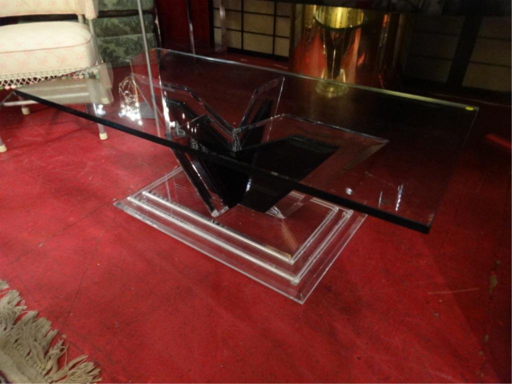 LUCITE COFFEE TABLE, CLEAR AND BLACK LUCITE, THICK: LUCITE COFFEE TABLE, CLEAR AND BLACK LUCITE, THICK GLASS TOP, LUCITE IS IN EXCELLENT CONDITION, APPROX 5'W