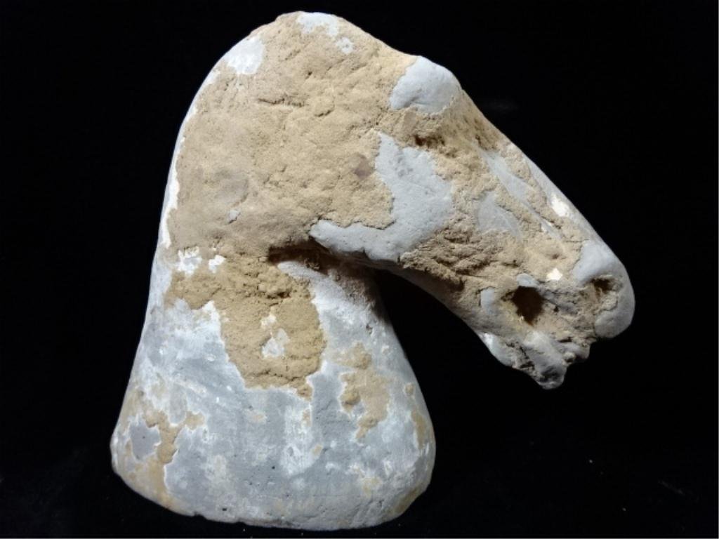 ANTIQUE CHINESE HAN DYNASTY POTTERY HEAD OF A HORSE,: ANTIQUE CHINESE HAN DYNASTY POTTERY HEAD OF A HORSE, 1ST - 2ND CENTURY (ESTIMATED ABOUT 25-220 AD). THE HEAD HAVING A GREY GROUND & RESIDUES OF BROWN & WHITE MUD, SAND & DIRT. IN GOOD ANTIQUE CONDITIO