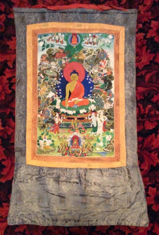 SHAKYAMUNI BUDDHA SINO-TIBETAN ANTIQUE THANGKA, THE: SHAKYAMUNI BUDDHA SINO-TIBETAN ANTIQUE THANGKA, THE SHAKYAMUNI BUDDHA SEATED IN VAJRASANA. BROCADED BORDER AND SILK BACKING. TIBETAN WAX ANTIQUITY SEAL REMAINS ON BACK. APPROX 23" X 37", SKU582