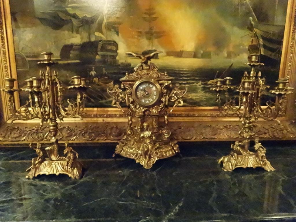 ORNATE GILT METAL CLOCK & GARNITURE SET, CLOCK APPROX: ORNATE GILT METAL CLOCK & GARNITURE SET, CLOCK APPROX 17.25"H, BATTERY OPERATED, GARNITURES EACH HOLD 7 CANDLES, APPROX 16.75"H