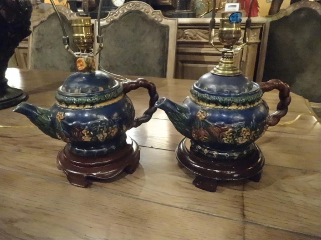 2 HILDA FLACK TEAPOT LAMPS, ON WOODEN BASES, NEAR PAIR,: 2 HILDA FLACK TEAPOT LAMPS, ON WOODEN BASES, NEAR PAIR, BASES SLIGHTLY DIFFERENT (SEE PHOTOS). APPROX 8"H NOT INCLUDING HARPS