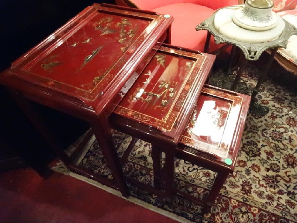 3 PC CHINESE RED LACQUER STACKING TABLES, RAISED: 3 PC CHINESE RED LACQUER STACKING TABLES, RAISED PAINTED LANDSCAPES, CRANES, AND FIGURES, LARGEST APPROX 20"W