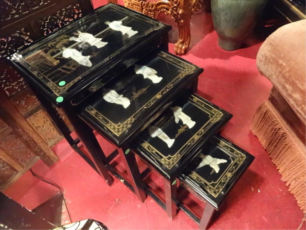 4 PC CHINESE STACKING TABLE SET, WITH CARVED STONE: 4 PC CHINESE STACKING TABLE SET, WITH CARVED STONE FIGURES, BLACK LACQUER FINISH, LARGEST APPROX 20"W