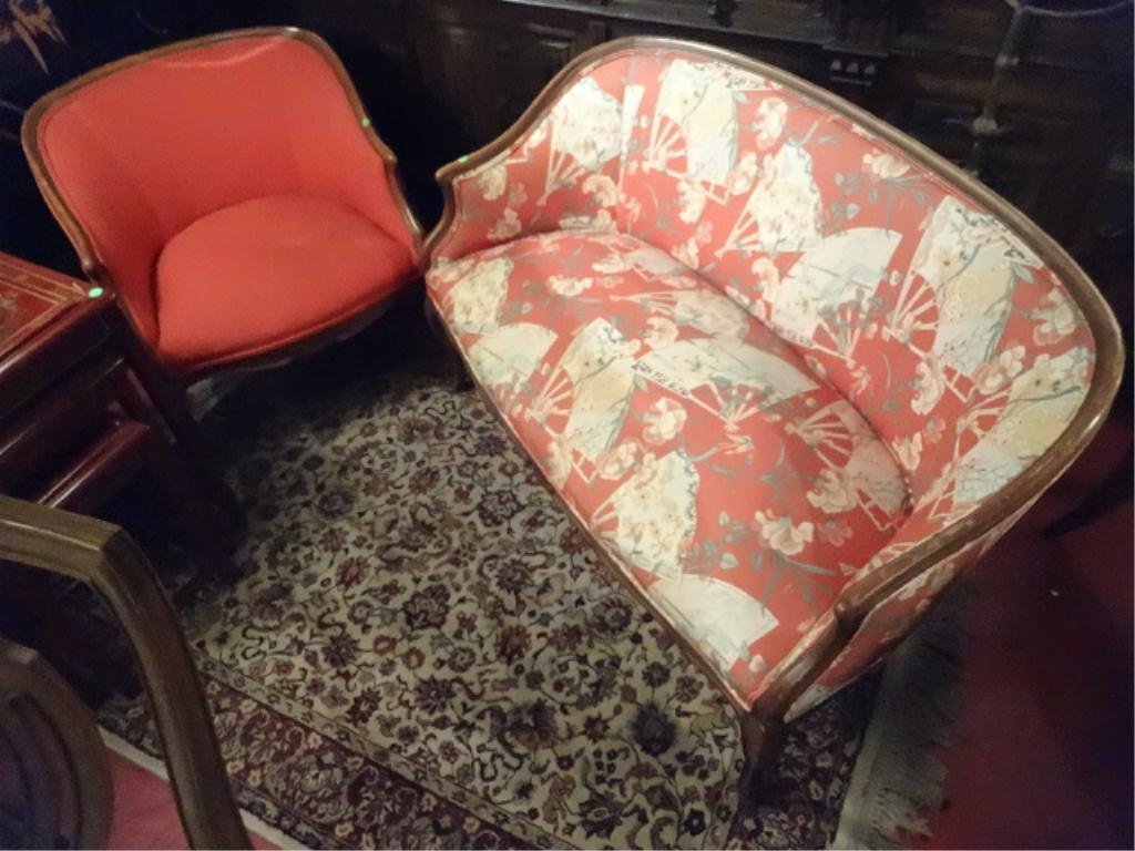 2 PC PARLOR SET FRENCH STYLE SETTEE AND CHAIR, TOMATO: 2 PC PARLOR SET FRENCH STYLE SETTEE AND CHAIR, TOMATO RED UPHOLSTERY, SETTEE HAS ASIAN FAN PRINT, GOOD CONDITION, 1 SMALL TEAR IN SEAT OF SETTEE, NEEDS RESPRINGING, SKU647.08