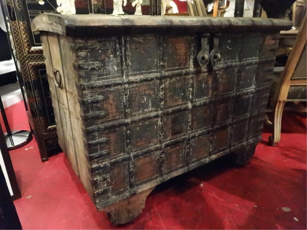 MASSIVE ANTIQUE DOWRY CHEST, ON WOOD WHEELS, THAI,: MASSIVE ANTIQUE DOWRY CHEST, ON WOOD WHEELS, THAI, RECTANGULAR WITH SLIGHTLY ROUNDED HINGED COVER, WITH ALL OVER METAL STRAPWORK, LOCKING INTERIOR STORAGE COMPARTMENT, APPROX 4'W