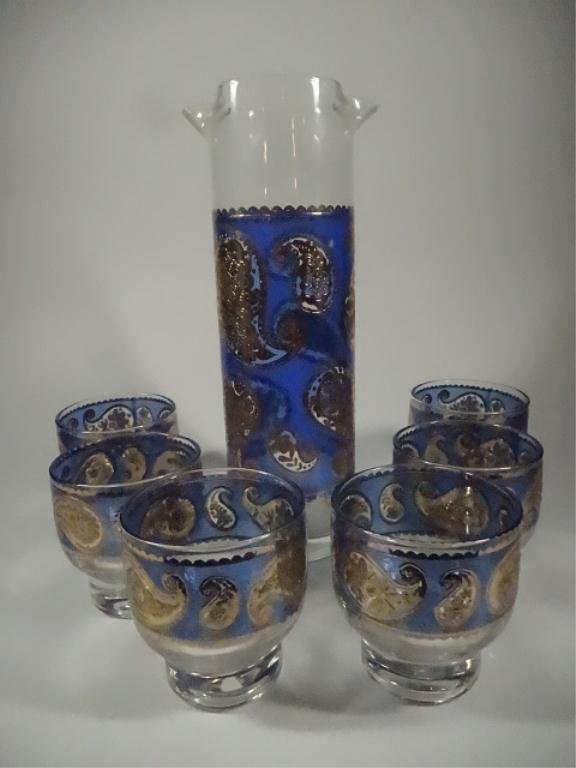 7 PC MID CENTURY CULVER LTD. GLASS MARTINI SET, 22 KT: 7 PC MID CENTURY CULVER LTD. GLASS MARTINI SET, 22 KT GOLD PAISLEY DESIGN WITH BLUE BACKGROUND, CIRCA 1940'S-1950'S, PINCHED PITCHER APPROX 9.25"H, 6 GLASSES APPROX 3"H, SKUAH