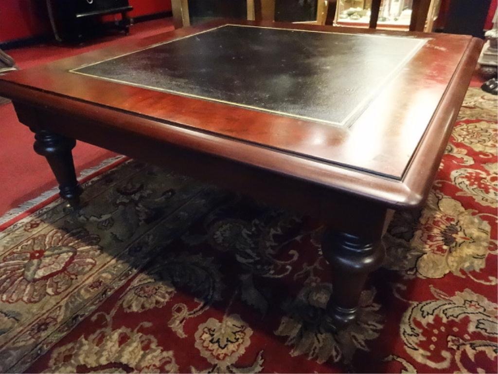 RALPH LAUREN WOOD COFFEE TABLE, GILT LEATHER TOP, BRASS: RALPH LAUREN WOOD COFFEE TABLE, GILT LEATHER TOP, BRASS CASTERS, LABELED RALPH LAUREN, EXCELLENT CONDITION, APPROX 4' X 4'