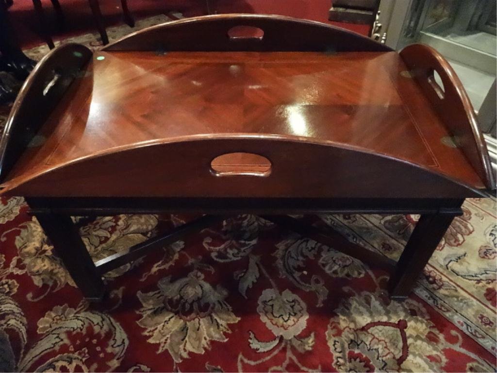 LARGE OVAL BUTLER COFFEE TABLE, DARK FINISH, BRASS: LARGE OVAL BUTLER COFFEE TABLE, DARK FINISH, BRASS HINGES, VERY GOOD CONDITION WITH ONE WATER MARK, ONE MISSING PIECE OF LOWER FRETWORK, APPROX 3.5'W, SKU709.02