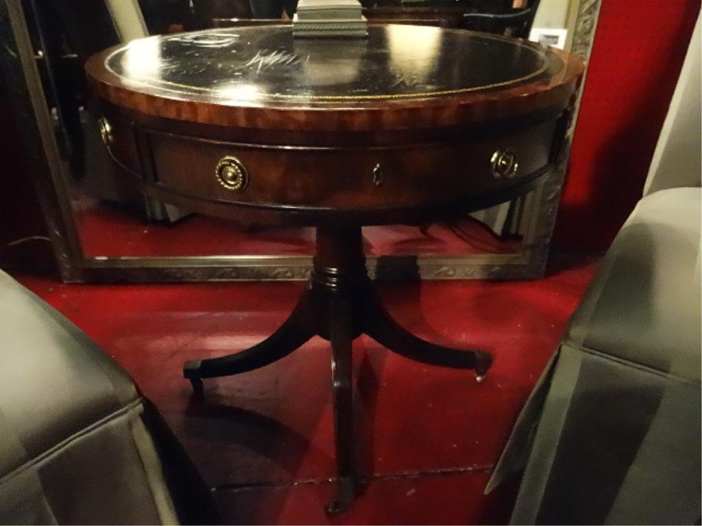 HENREDON MAHOGANY PEDESTAL TABLE, GILT EMBOSSED LEATHER: HENREDON MAHOGANY PEDESTAL TABLE, GILT EMBOSSED LEATHER TOP, BRASS PULLS AND CASTERS, STAMPED HENREDON MARK, APPROX 25"DIAMETER