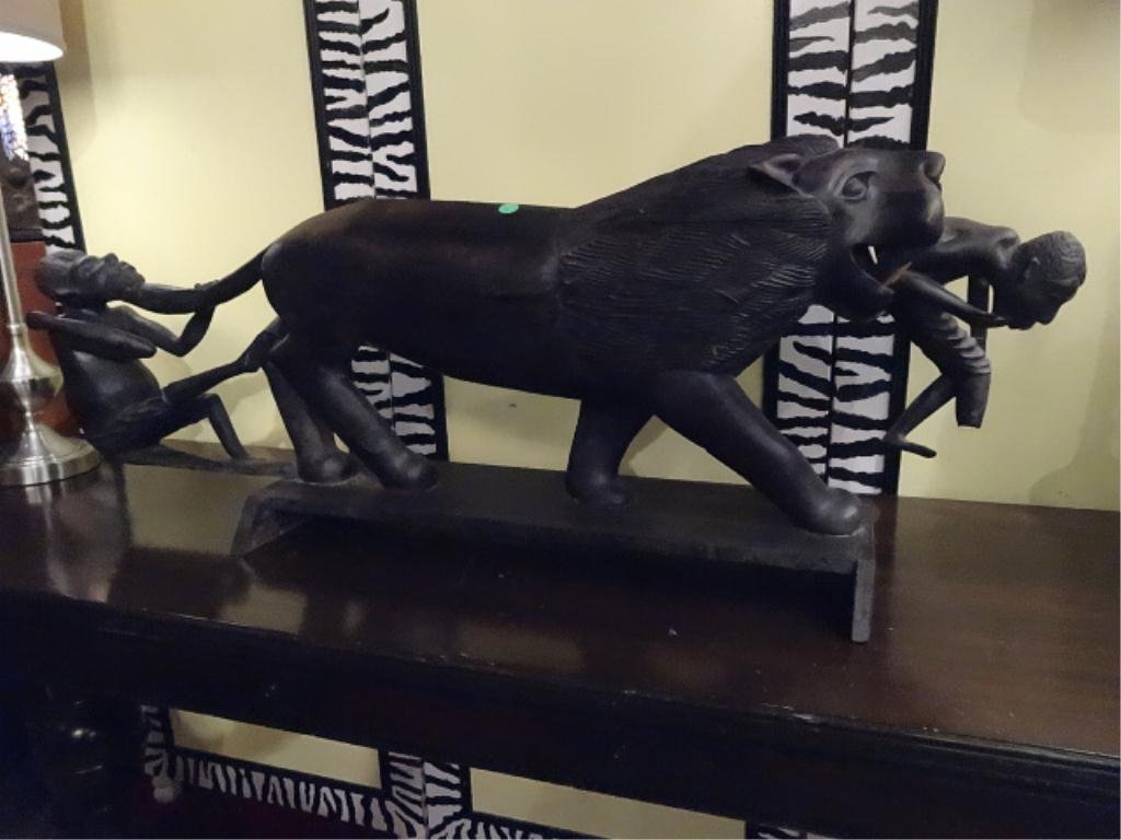 LARGE AFRICAN EBONY WOOD STATUE, LION FIGHTING 2: LARGE AFRICAN EBONY WOOD STATUE, LION FIGHTING 2 FIGURES, SOLID EBONY, VERY GOOD CONDITION WITH LOWER LEG MISSING ON ONE FIGURE (SEE PHOTO AND SPEAR MISSING), 43"W X 16"H, SKU744.14