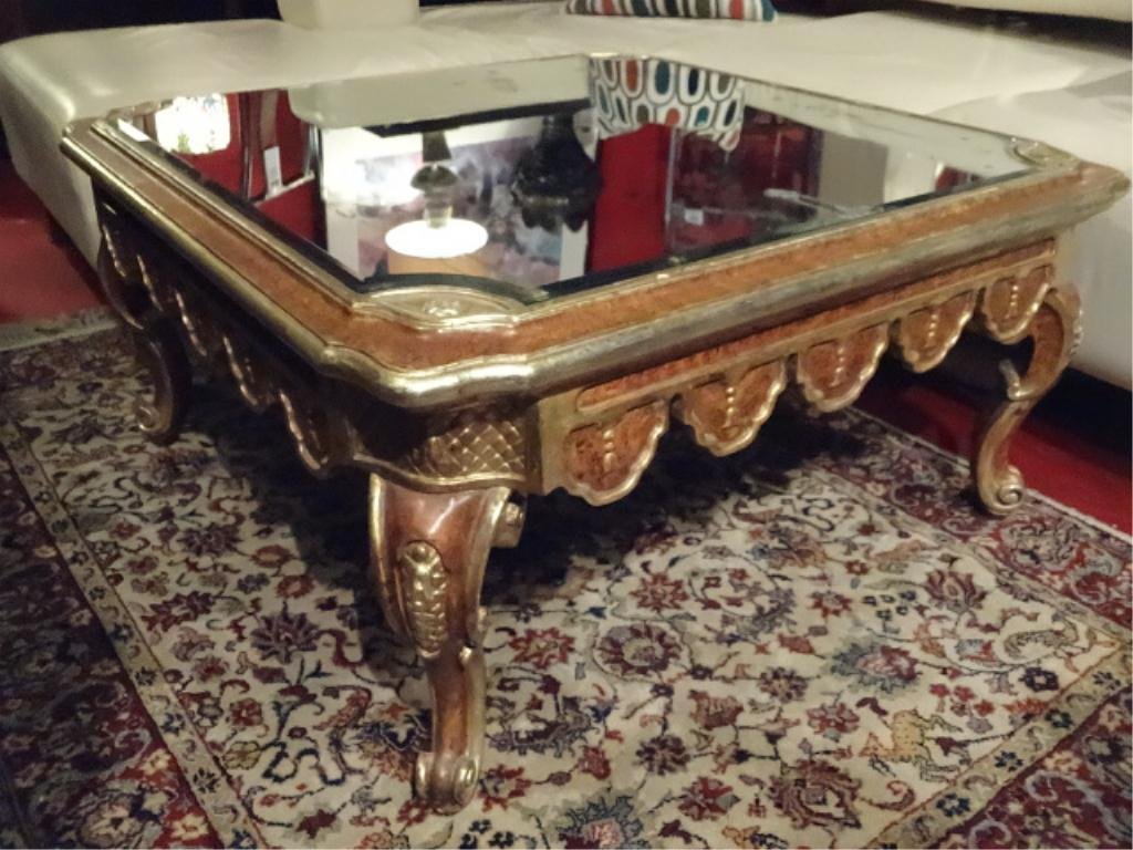 GILT WOOD COFFEE TABLE, MIRRORED TOP, CABRIOLE LEGS,: GILT WOOD COFFEE TABLE, MIRRORED TOP, CABRIOLE LEGS, VERY GOOD CONDITION OVERALL, MIRRORED TOP HAS SOME LOSS OF SILVERING AND A CHIP ON ONE EDGE, APPROX 3.5' X 3.5', SKU710.01