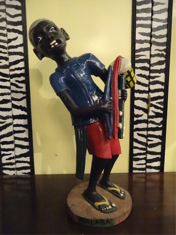 AFRICAN CARVED WOOD STATUE, PAINTED BOY PLAYING: AFRICAN CARVED WOOD STATUE, PAINTED BOY PLAYING INSTRUMENT, APPROX 23'H, SKU744.46
