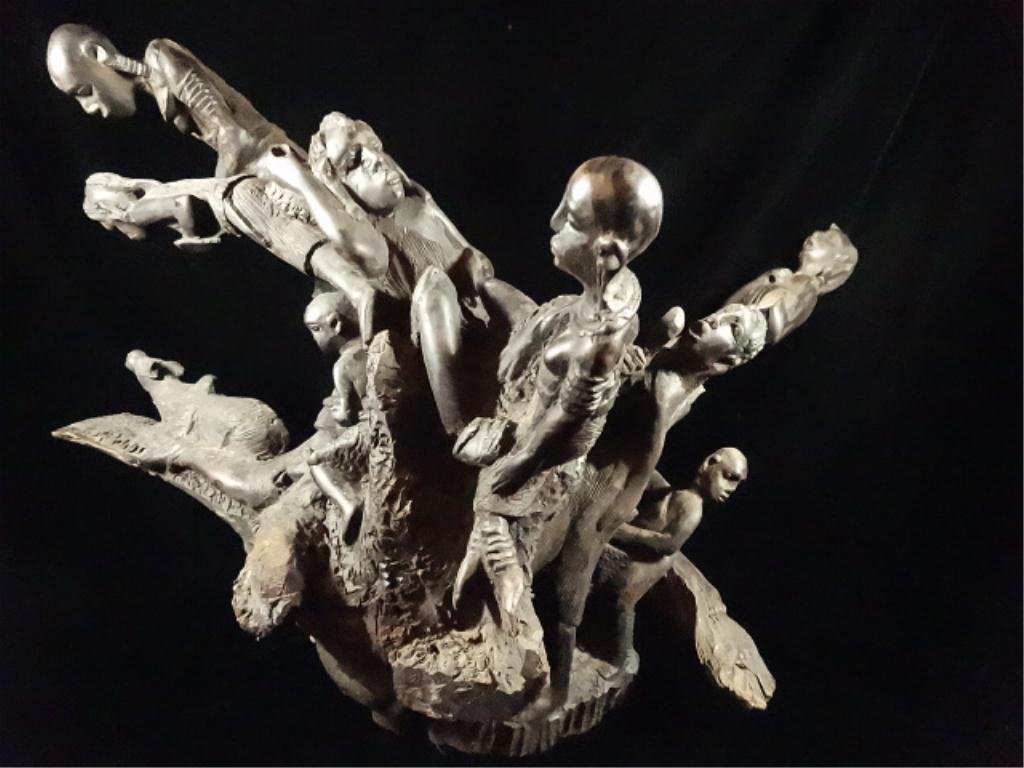 AFRICAN CARVED WOOD EBONY FIGURAL GROUP WITH PEOPLE AND: AFRICAN CARVED WOOD EBONY FIGURAL GROUP WITH PEOPLE AND ANIMALS, APPROX 15.75"H X 24"W, SKU744.41