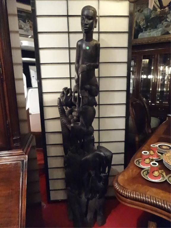 HUGE AFRICAN EBONY WOOD STATUE, MALE FIGURE SURMOUNTING: HUGE AFRICAN EBONY WOOD STATUE, MALE FIGURE SURMOUNTING A VARIETY OF ANIMALS AND PLANTS, SOLID EBONY, EXCELLENT CONDITION, 6.5"H, SKU744.2